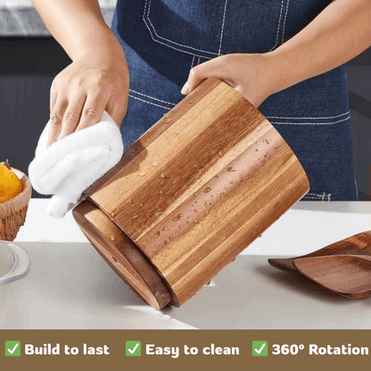Person cleaning a wooden utensil holder with a cloth on a kitchen counter.