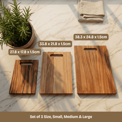 Set of three wooden cutting boards with measurements on a marble surface.