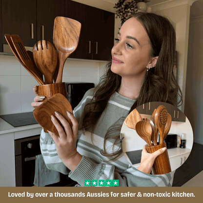 Woman holding wooden kitchen utensils in a kitchen setting