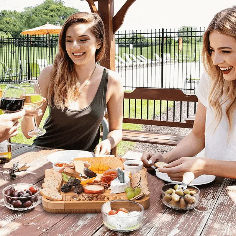 Woodastic™ Cheese Platter Set in use with 2 women