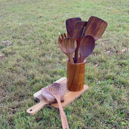 Organic mineral oil showing next the woodastic 9 pcs utensil set and a grass background