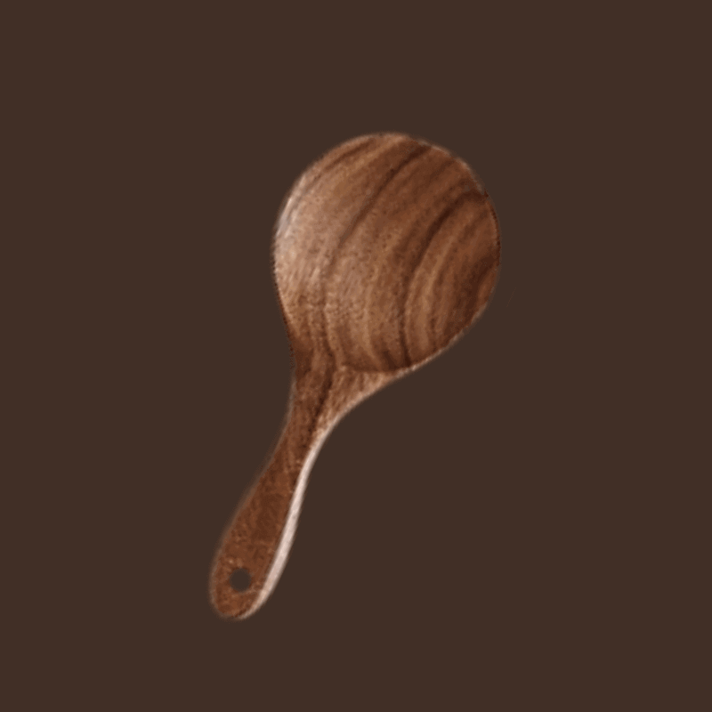 Wooden paddle on a dark brown background